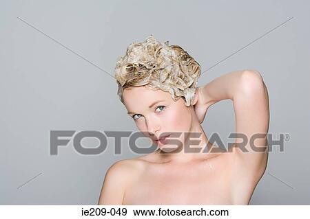 Portrait of a woman with shampoo in her hair View Large Photo Image Stock Photo - Portrait of a woman with shampoo in her hair. Fotosearch