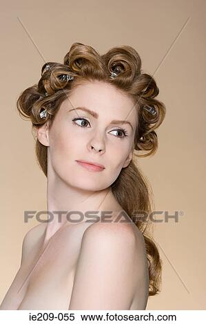 Stock Photography - Portrait of woman with hair clips in her hair. Fotosearch
