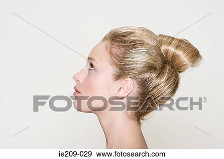 Profile of a woman with a hairstyle View Large Photo Image Stock Photo - Profile of a woman with a hairstyle. Fotosearch