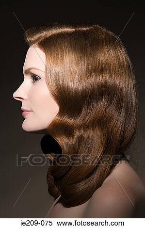 Stock Photography - Profile of a woman with ginger hair. Fotosearch