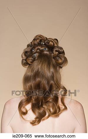 Stock Photography - Rear view of a woman with a hairstyle. Fotosearch
