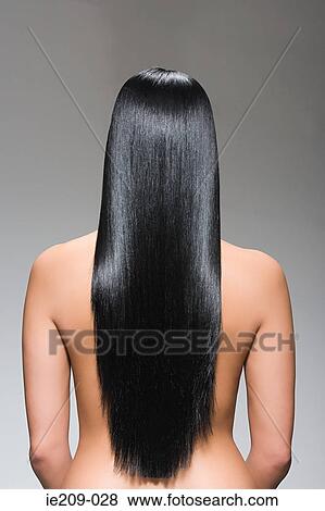 Stock Photo - Rear view of a woman with long hair. Fotosearch