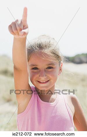 A girl pointing View Large Photo Image Stock Image - A girl pointing. Fotosearch