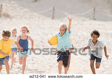 Children running across beach View Large Photo Image Stock Image - Children running across beach. Fotosearch