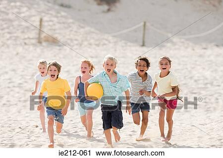 Children running across beach View Large Photo Image Stock Image - Children running across beach. Fotosearch