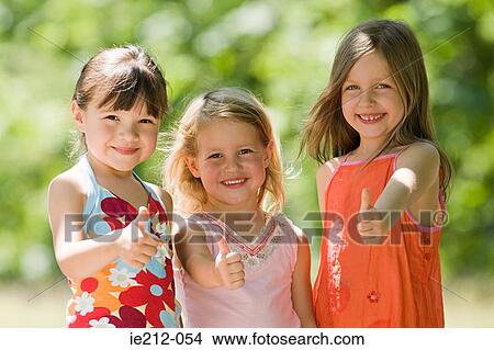 Portrait of friends with thumbs up View Large Photo Image Picture - Portrait of friends with thumbs up. Fotosearch