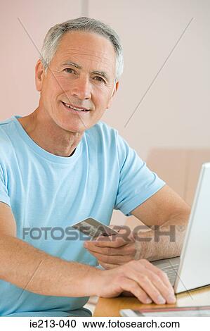A man buying online View Large Photo Image Stock Image - A man buying online. Fotosearch