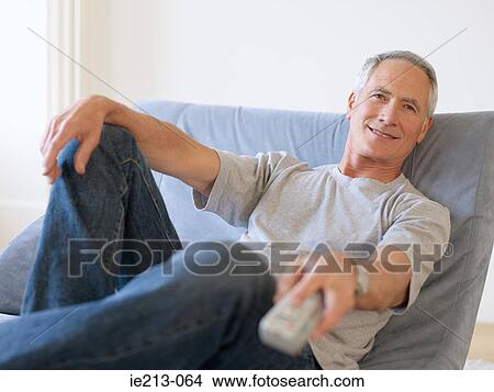 A man watching tv View Large Photo Image Picture - A man watching tv. Fotosearch