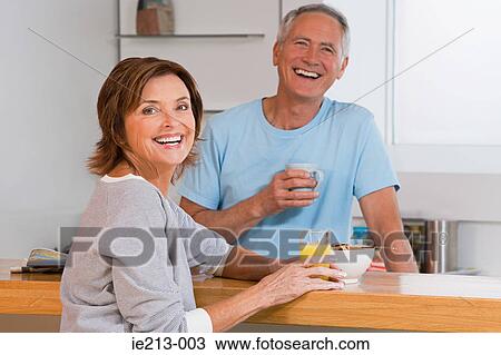 Portrait of a senior couple having breakfast View Large Photo Image Stock Image - Portrait of a senior couple having breakfast. Fotosearch