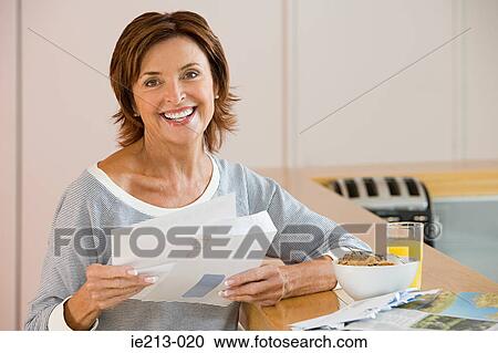 Portrait of a woman holding letters View Large Photo Image Stock Image - Portrait of a woman holding letters. Fotosearch