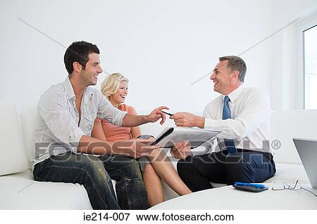 Stock Photo - Couple and estate agent. Fotosearch