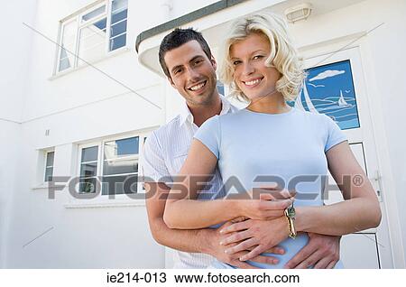 Couple outside house View Large Photo Image Stock Image - Couple outside house. Fotosearch