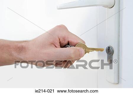 Door and person with key View Large Photo Image Stock Image - Door and person with key. Fotosearch