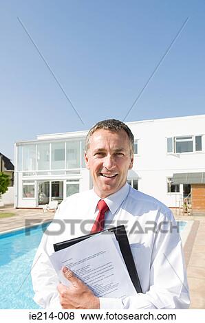 Estate agent and luxury house View Large Photo Image Stock Photo - Estate agent and luxury house. Fotosearch