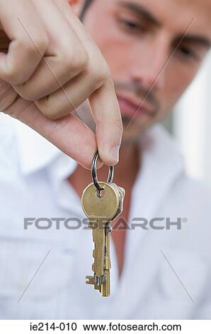 Man holding keys View Large Photo Image Stock Image - Man holding keys. Fotosearch