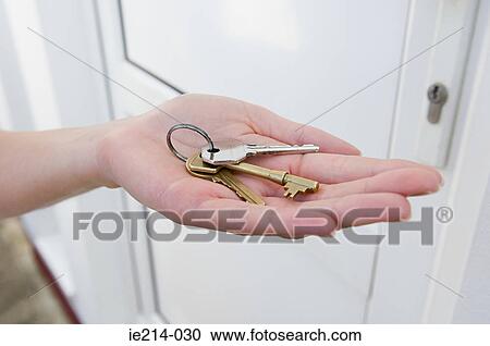 Stock Image - Person holding keys. Fotosearch