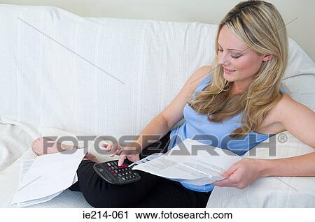 Woman doing home finances View Large Photo Image Stock Image - Woman doing home finances. Fotosearch
