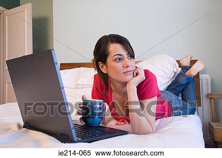 Woman on bed View Large Photo Image Stock Photography - Woman on bed. Fotosearch