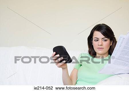 Woman with bills and calculator View Large Photo Image Stock Image - Woman with bills and calculator. Fotosearch