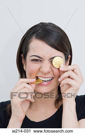 Woman with chocolate coins View Large Photo Image Stock Image - Woman with chocolate coins. Fotosearch