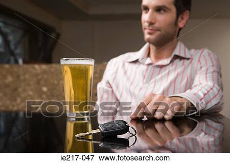 Stock Photo - Car keys and a pint of lager. Fotosearch