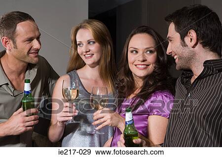 Stock Photo - Couples flirting in a bar. Fotosearch