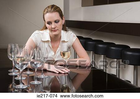 Picture - Drunken woman in a bar. Fotosearch