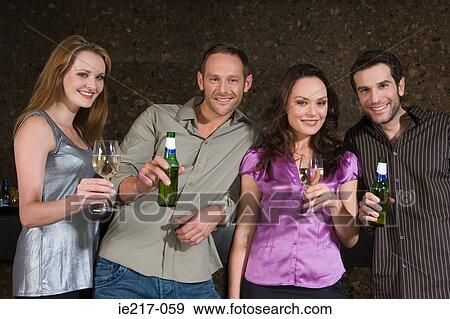 Four people in a bar View Large Photo Image Stock Photo - Four people in a bar. Fotosearch