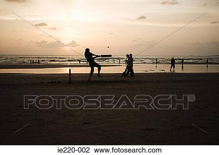 People playing cricket on mumbai beach View Large Photo Image Stock Image - People playing cricket on mumbai beach. Fotosearch