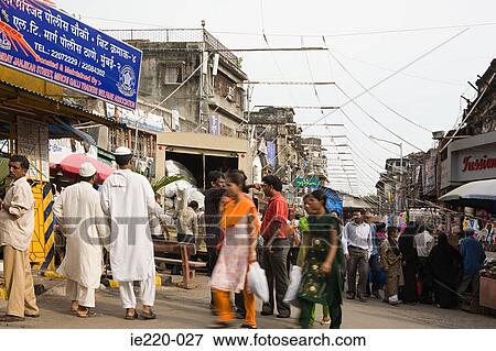 People walking through a market View Large Photo Image Stock Photo - People walking through a market. Fotosearch