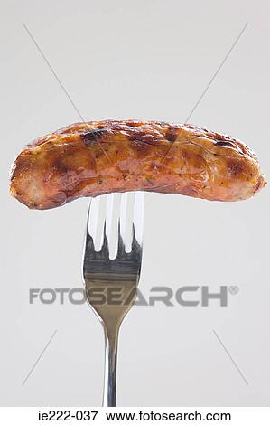 A sausage on a fork View Large Photo Image Stock Photo - A sausage on a fork. Fotosearch
