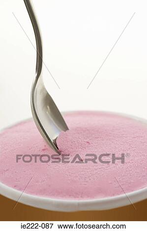 A spoon and container of icecream View Large Photo Image Stock Photo - A spoon and container of icecream. Fotosearch