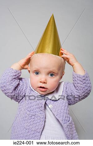 Baby with a party hat View Large Photo Image Stock Image - Baby with a party hat. Fotosearch