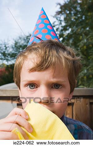 Boy in a party hat View Large Photo Image Stock Image - Boy in a party hat. Fotosearch