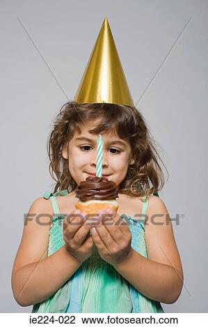 Girl with birthday cupcake View Large Photo Image Stock Image - Girl with birthday cupcake. Fotosearch