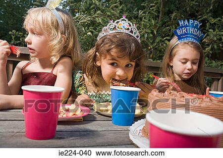 Girls eating birthday cake View Large Photo Image Stock Image - Girls eating birthday cake. Fotosearch