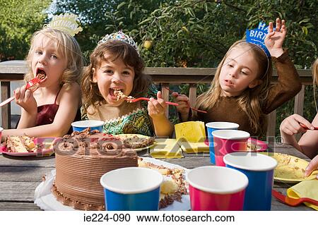 Girls eating birthday cake View Large Photo Image Stock Image - Girls eating birthday cake. Fotosearch