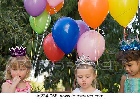 Stock Photo - Girls with balloons. Fotosearch