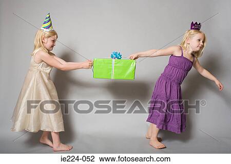 Girls with birthday present View Large Photo Image Stock Image - Girls with birthday present. Fotosearch