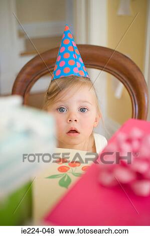 Little girl wearing party hat View Large Photo Image Stock Photo - Little girl wearing party hat. Fotosearch