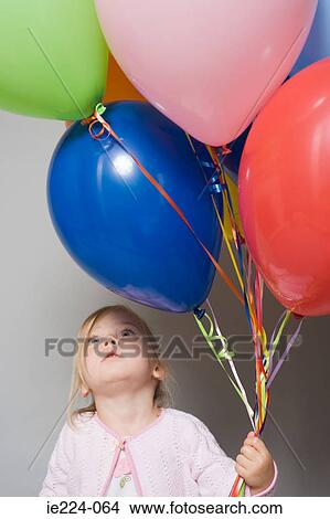 Little girl with balloons View Large Photo Image Picture - Little girl with balloons. Fotosearch