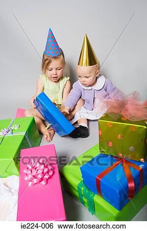 Little girls with birthday presents View Large Photo Image Stock Photograph - Little girls with birthday presents. Fotosearch