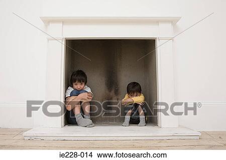 Boys Hiding In A Fireplace Picture Ie228 014 Fotosearch