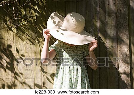 Girl wearing a sun hat View Large Photo Image Stock Image - Girl wearing a sun hat. Fotosearch