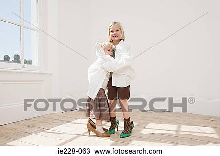 Stock Image - Girls dressing up. Fotosearch