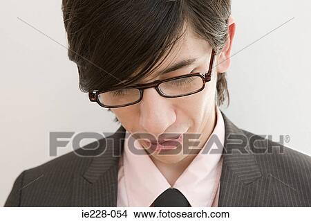 Head and shoulders of a young businessman View Large Photo Image Picture - Head and shoulders of a young businessman. Fotosearch