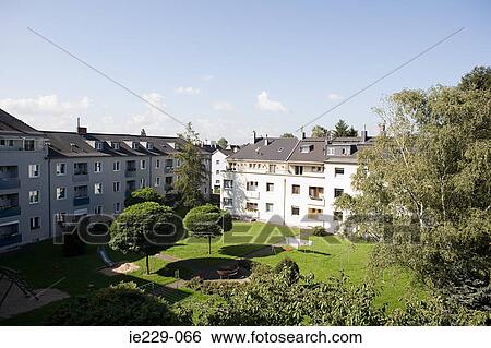 A garden and apartments View Large Photo Image Stock Photograph - A garden and apartments. Fotosearch
