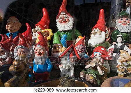 Garden gnomes in a shop window View Large Photo Image Stock Photo - Garden gnomes in a shop window. Fotosearch