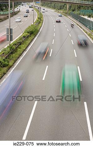 Traffic on a highway View Large Photo Image Stock Photography - Traffic on a highway. Fotosearch