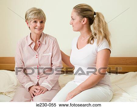 Daughter comforting her mother View Large Photo Image Stock Photography - Daughter comforting her mother. Fotosearch